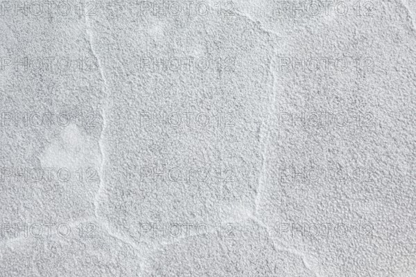Rough grey plaster surface with visible structure, The Salar de Cauchari salt pan near Salta in