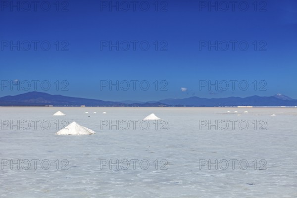 Bright salt landscape with small hills and foothills in the background, clear quiet atmosphere, The