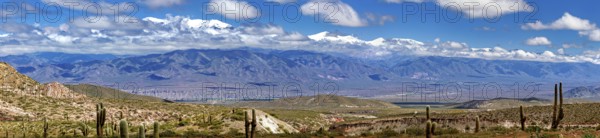 Panoramic picture of a wide mountain landscape with valley and clear sky, The landscape of the