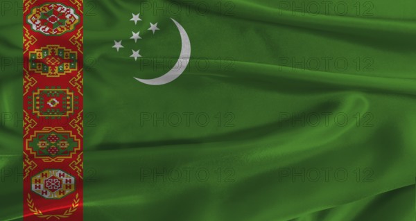 Flag of Turkmenistan with fabric textured background. Close up of National flag of Turkmenistan