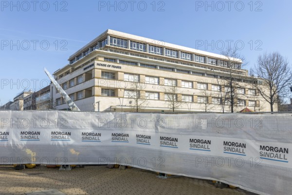 Morgan Sindall construction site screens with House of Fraser building, city centre of Plymouth,