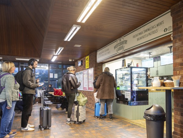 Passengers queuing at The Westcountry Larder Coffee takeaway shop shop, Tiverton Parkway railway