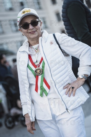 A participant in the colors of Iran at the demonstration by exiled Iranians under the motto Freedom