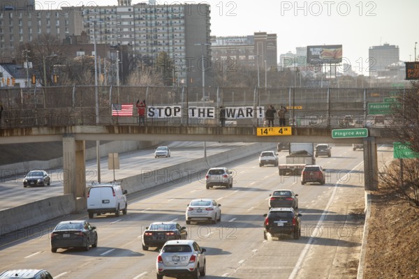 Detroit, Michigan USA - 2 March 2026 - Signs are posted on a pedestrian crosswalk over a freeway