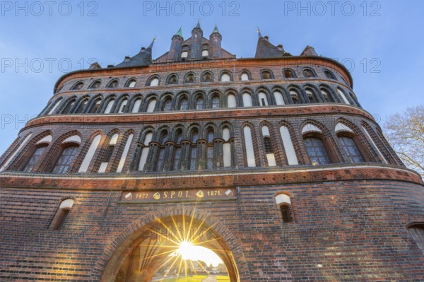 15th century Brick Gothic city gate Holstentor, Holstein Gate in the Hanseatic town Lübeck at