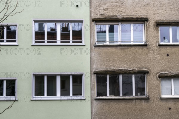 Windows, gray house facades, a house is renovated, renovation, modernization, contrast, difference,