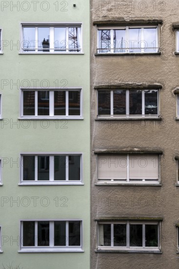 Windows, gray house facades, a house is renovated, renovation, modernization, contrast, difference,