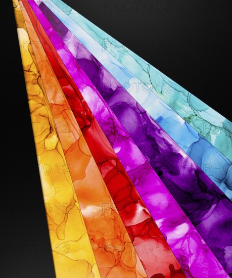Diagonal lines of colors inks with a liquid texture in paper create a striking contrast against a