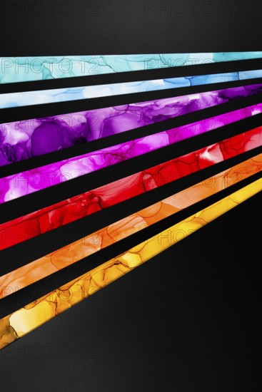 Striking diagonal streaks of vibrant colors inks including blue, purple, pink, red, and yellow