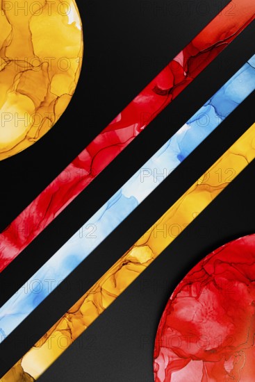 A vibrant abstract image featuring colorful geometric shapes on paper. Bold red, yellow, and blue
