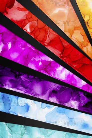 Diagonal layers of colorful ink create a dynamic abstract composition in paper. Vivid reds,