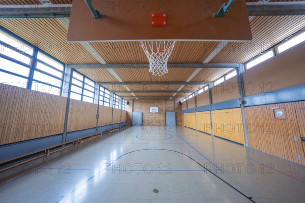 Large, bright gym with basketball hoop and floor markings, Schlehengäu Grund Schule Gechingen, Calw