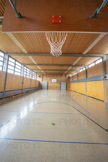 Sports hall with basketball hoop and wooden floor, ideal for various ball games, Schlehengäu Grund