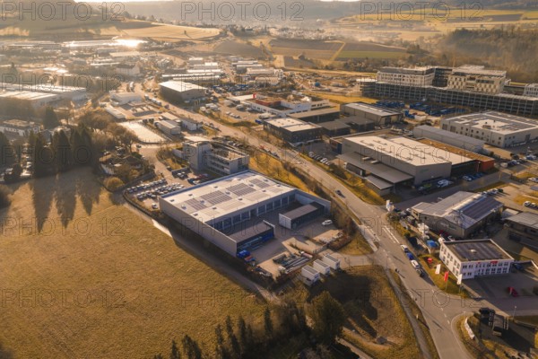 Panoramic aerial view of an industrial complex surrounded by fields and roads, Calw, Calw district,