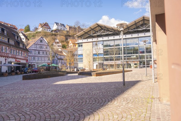 Town square with a mix of modern and traditional architecture in sunny weather, Calw, Calw