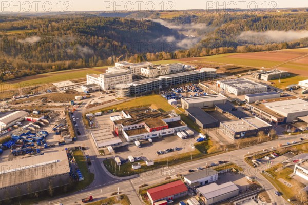 Industrial area surrounded by forest and hills with urban features, new hospital at Calw Health