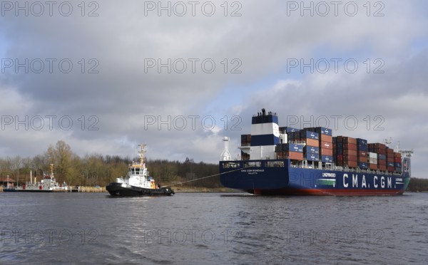 Container ship CMA CGM RUNDALE and tugboat STEIN sail in the Kiel Canal, NOK, Kiel Canal, Kiel