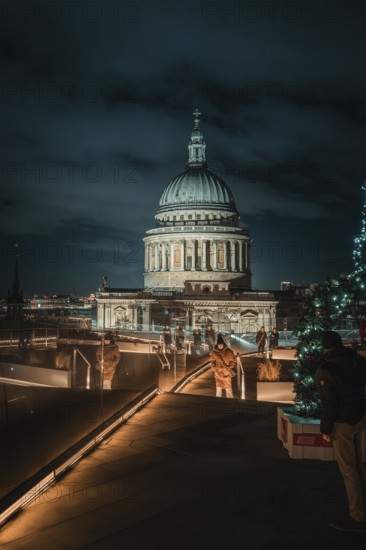 Atmospheric view of illuminated St. Paul's Cathedral from a roof terrace with Christmas