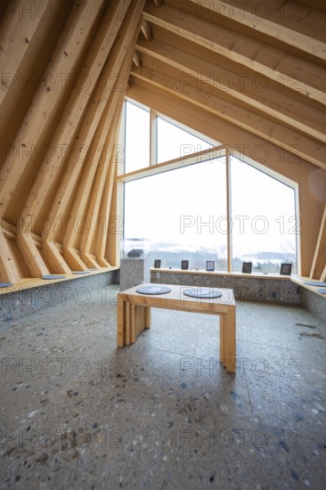 Modern interior with wooden elements and large window showing nature, Sinnraum, Oberreute, Allgäu,