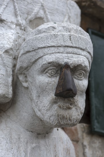 Detail of the marble statue of a merchant family from the 13th and 14th century, Campo dei Mori in