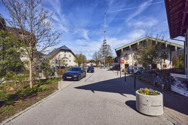 Maypole, alpine buildings, general architecture, houses, barrier bollards, flower pots, parking