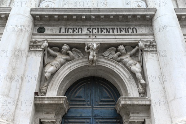 Entrance portal with angel sculptures from the University of Science, Venice, Veneto, Italy