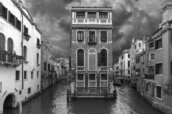 Historic Palazzo Tetta surrounded by canals, black and white, Venice, Veneto, Italy
