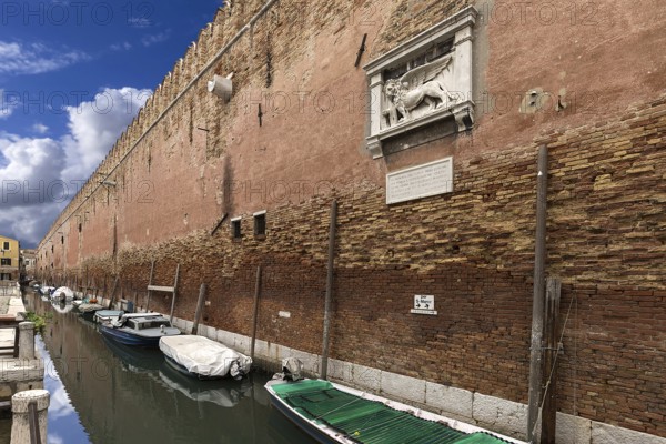 Historic wall from the Arsenal, relief with the heraldic animal of the Venetian lion, Venice,