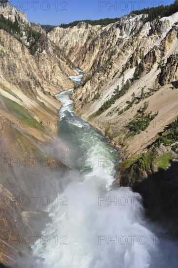 A powerful river rushes through a narrow canyon fringed by dramatic cliffs, Grand Canyon of the
