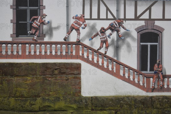 Mural construction by Jaune 2020, alleyway art, graffiti, construction workers jumping on