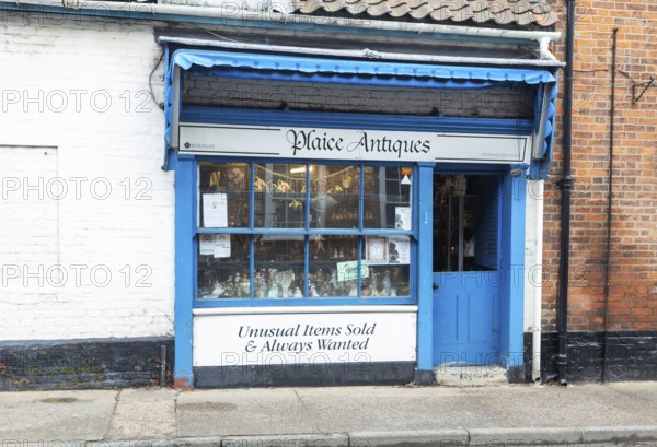 Shop window shopfront of small specialist antique shop, Plaice Antiques, Beccles, Suffolk, England,