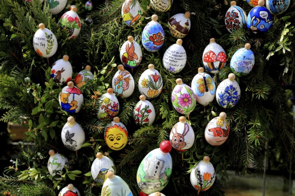 Detail, eggs painted by children, comic characters, Easter fountain in Heiligenstadt, Franconian