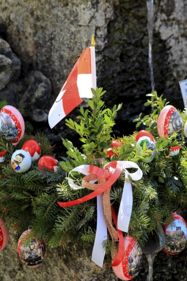 Detail of an Easter fountain in Franconian colors red and white, Franconian Switzerland, in