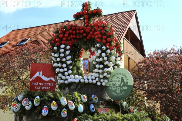 Detail of an Easter fountain in Franconian colors red and white, Franconian Switzerland, in