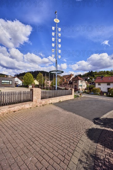Maypole, sandstone wall, wooden fence, roads, general buildings, residential buildings, hills,