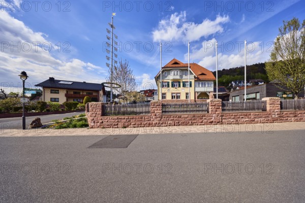 Town hall, maypole, flagpoles, lantern, sandstone wall, wooden fence, street, general development,