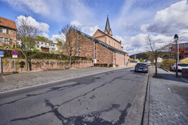 St. Michael church, sandstone wall, general architecture, houses, lantern, parking strips with car,