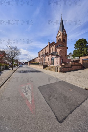 St. Michael church, parish church, neo-Romanesque style, sidewalk, roadway, road marking Attention