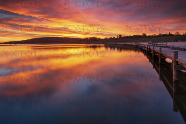 Jetty at sunrise on Geiseltalsee, artificial lake, open-cast mining lake, recultivated open-cast