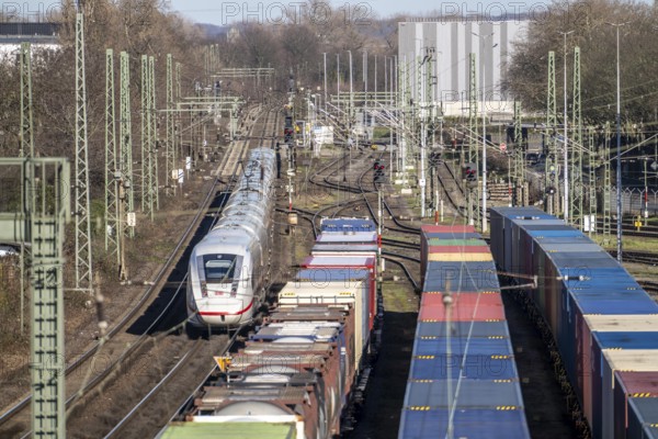 ICE long-distance train, on the line, container trains in the freight yard, so-called installation