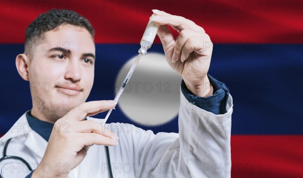 Doctor holding syringe on Laos flag background. Medical professional holding syringe with Laotian