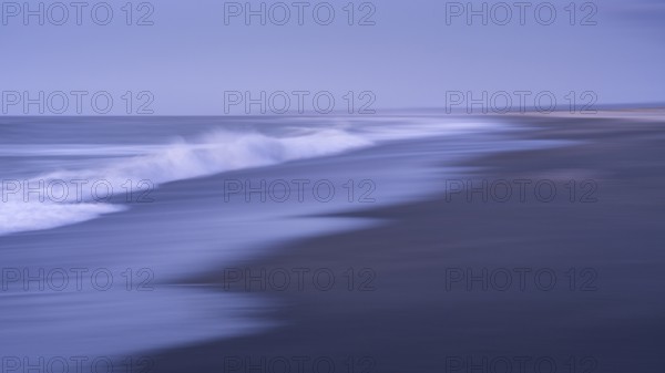 Okarito Beach in the evening with sea and sandy beach. Long exposure, blurred (ICM) . Westland Tai