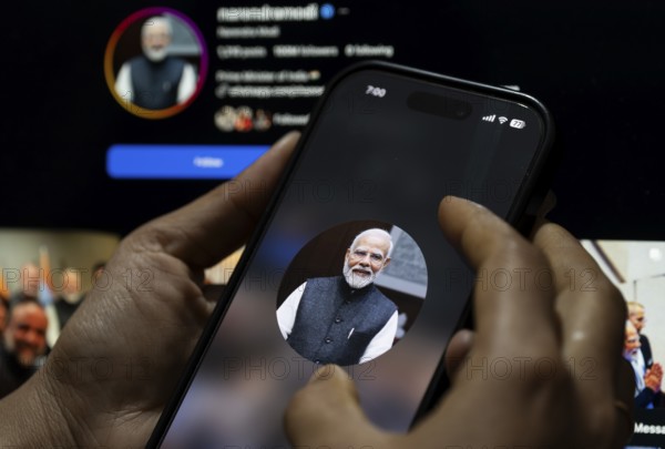 In this photo illustration, a close view of a smartphone displaying the profile picture of Indian