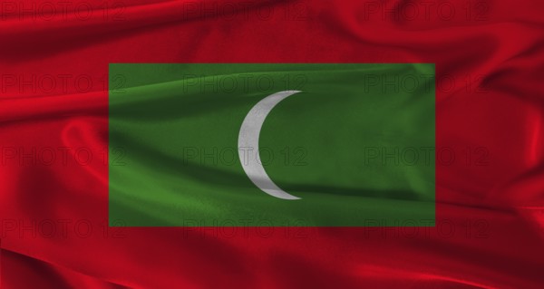 Flag of Maldives with fabric textured background. Close up of National flag of Maldives with