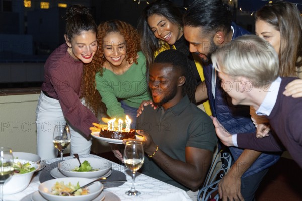 A lively group of friends celebrating a special occasion They gather around a table, smiling and