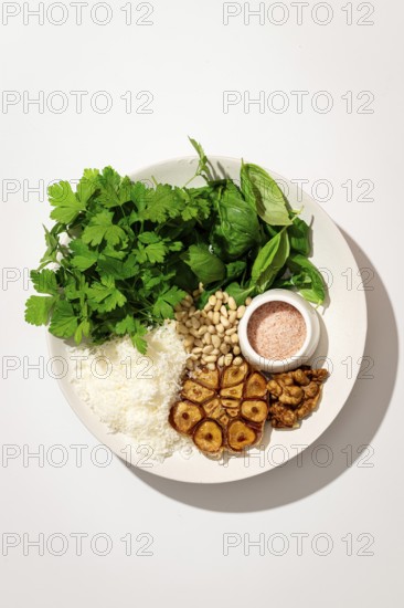 Top view of a plate with fresh ingredients for making Italian pesto gnocchi, featuring potatoes,
