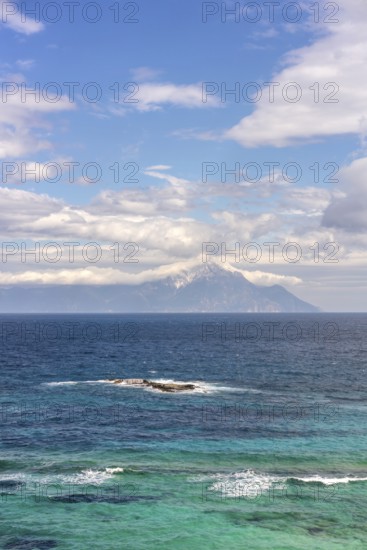 Captivating view of the Aegean Sea with vibrant blue and turquoise waters in Greece. Mount Athos