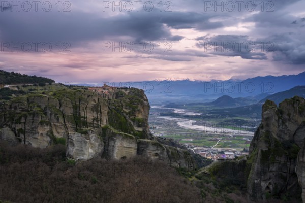 Captivating sunset view of the historic Holy Trinity Monastery perched atop towering cliffs in