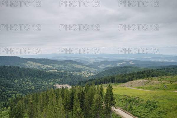 A panoramic view of the lush, green landscape surrounding Bachledka Ski Sun in Zdiar, Slovakia,