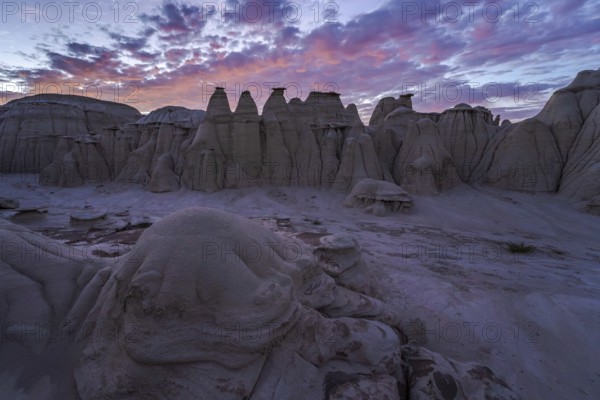 Stunning sunset illuminating the eroded sandstone formations in the Bisti/De-Na-Zin Wilderness,